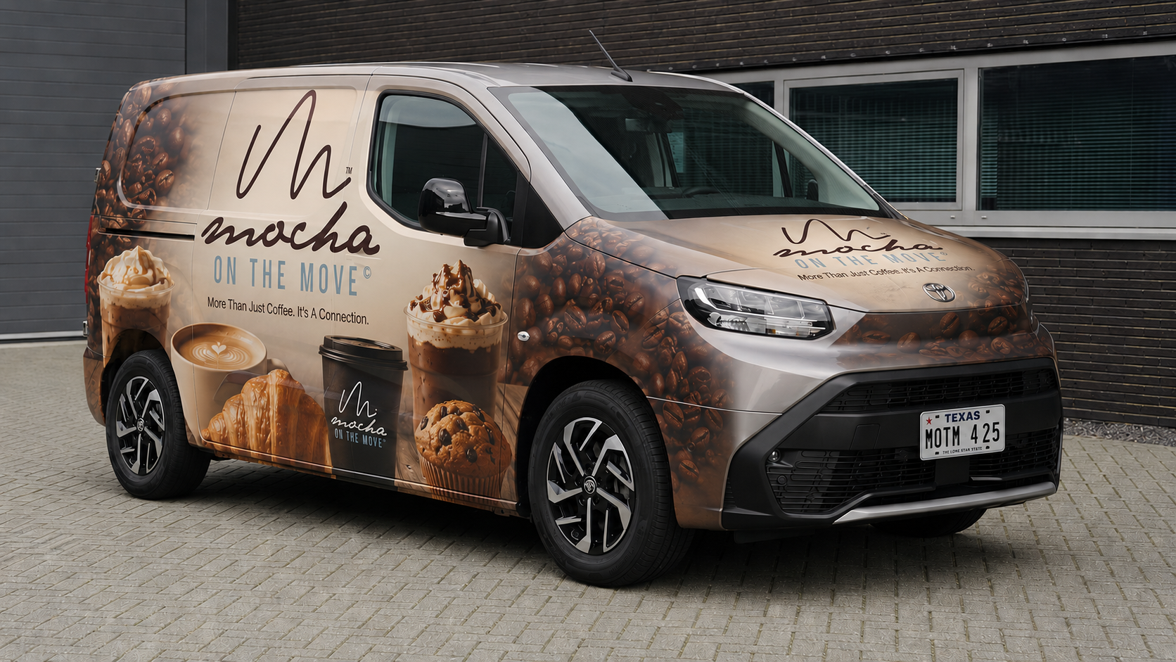 Barista serving coffee from Mocha on the Move delivery van